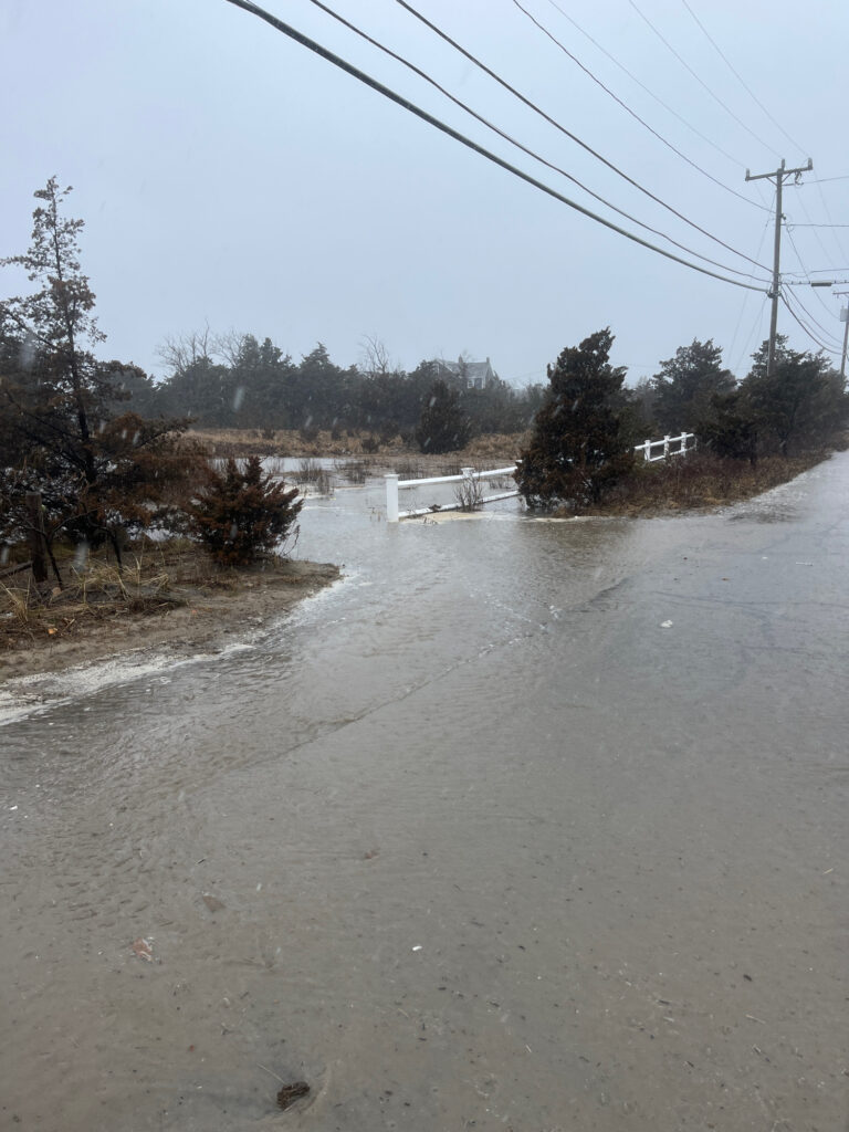 a flooded road with power lines (MyCoast AI)