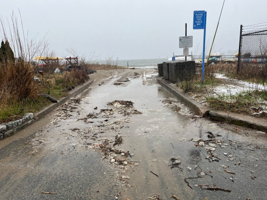 a road with a fence and a beach in the background (MyCoast AI)