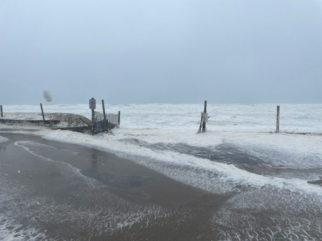 a beach with waves crashing on it (MyCoast AI)