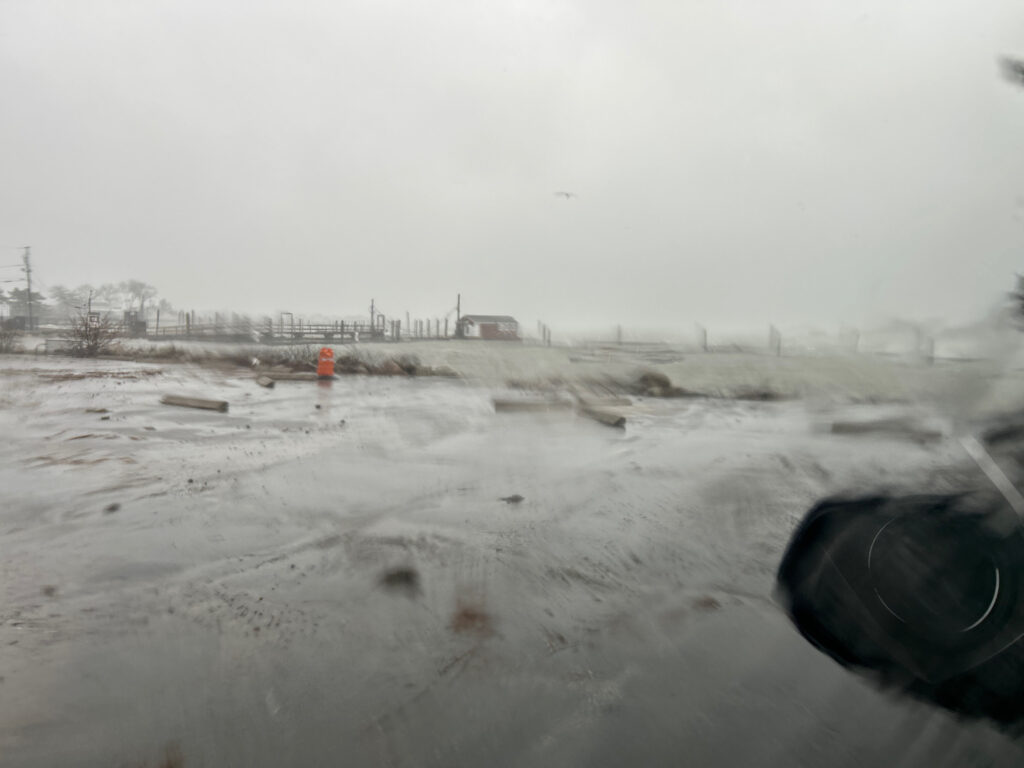 a snowy field with a building in the distance (MyCoast AI)