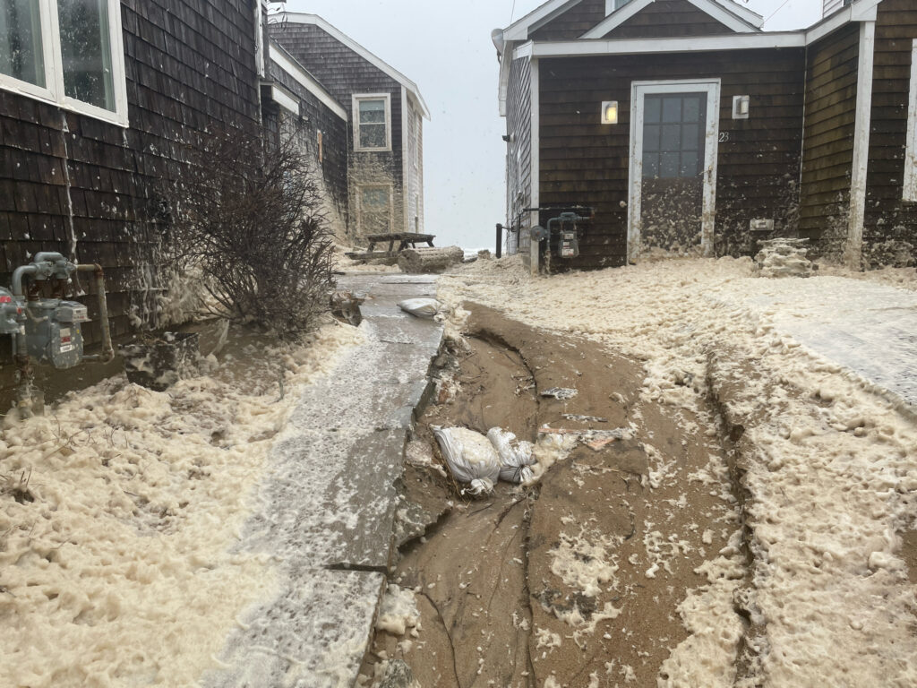 a pile of dirt in front of a house (MyCoast AI)