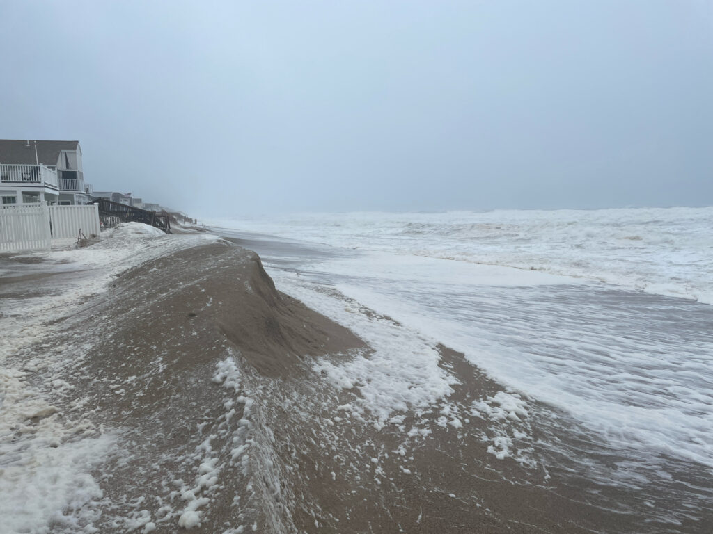 a beach with waves crashing on it (MyCoast AI)