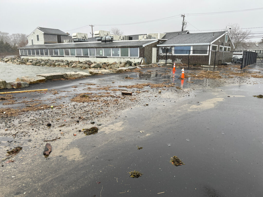a muddy area with buildings in the background (MyCoast AI)