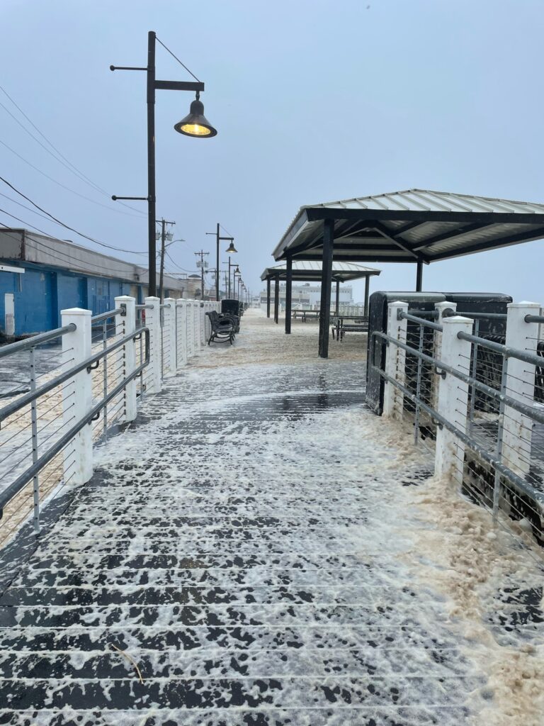 a snowy walkway with a covered walkway (MyCoast AI)