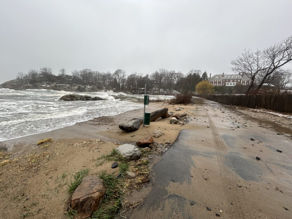 a beach with rocks and a sign (MyCoast AI)