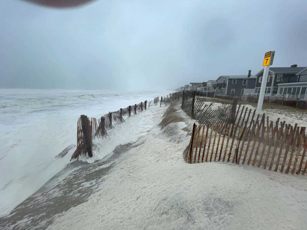 a wooden fence on a beach (MyCoast AI)