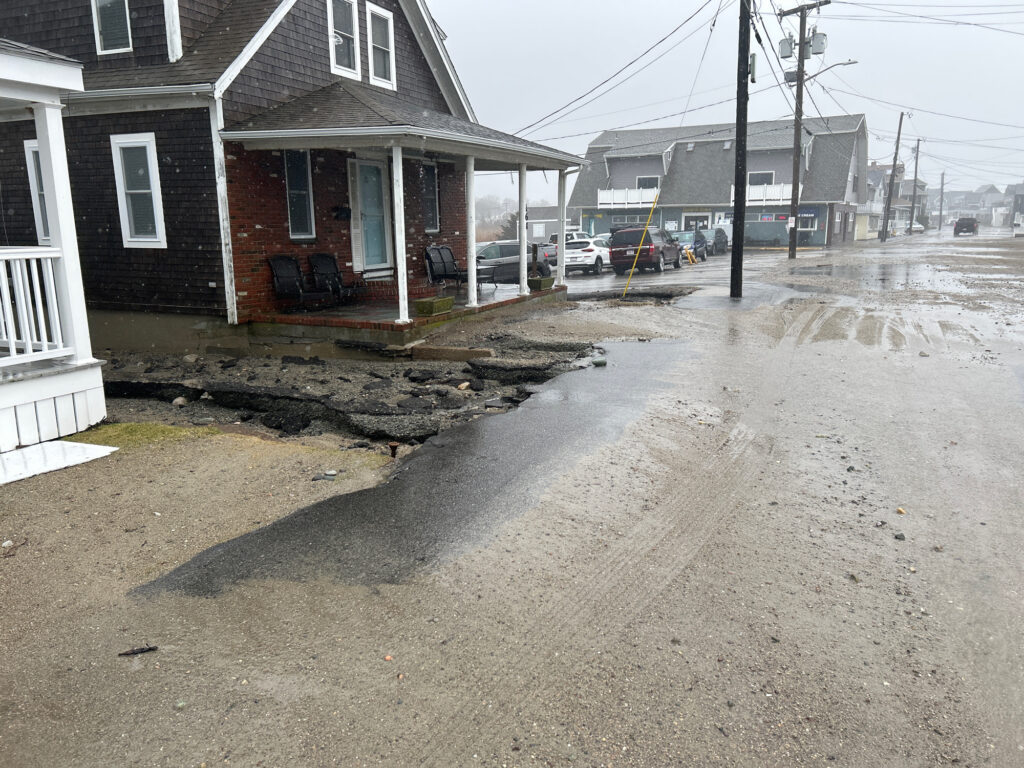 a street with houses and a puddle (MyCoast AI)