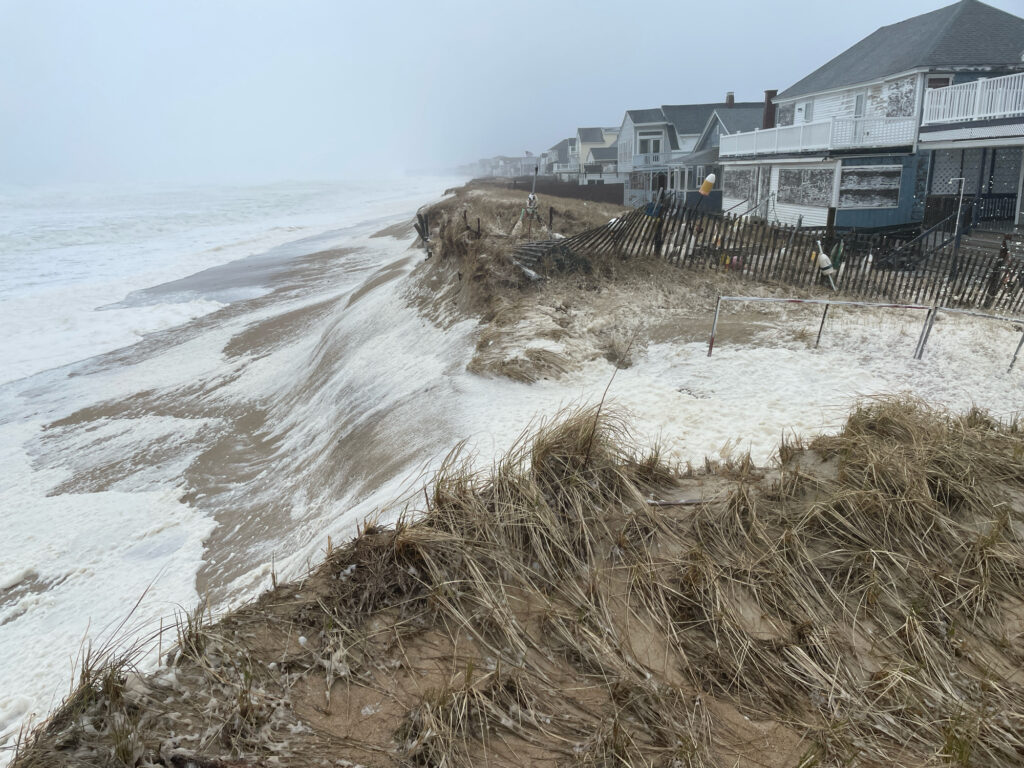 a beach with waves crashing on it (MyCoast AI)