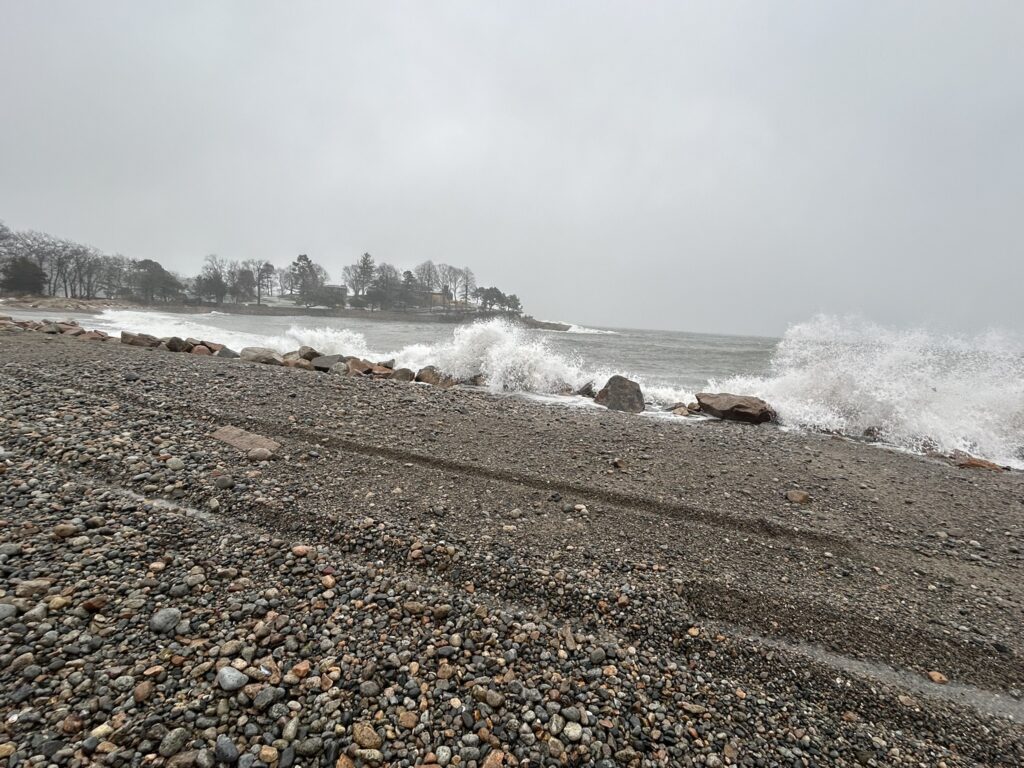 a rocky beach with waves crashing (MyCoast AI)