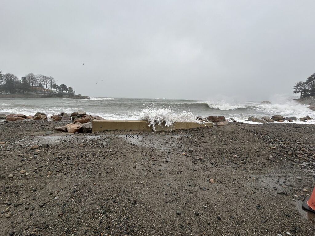 a beach with waves crashing (MyCoast AI)