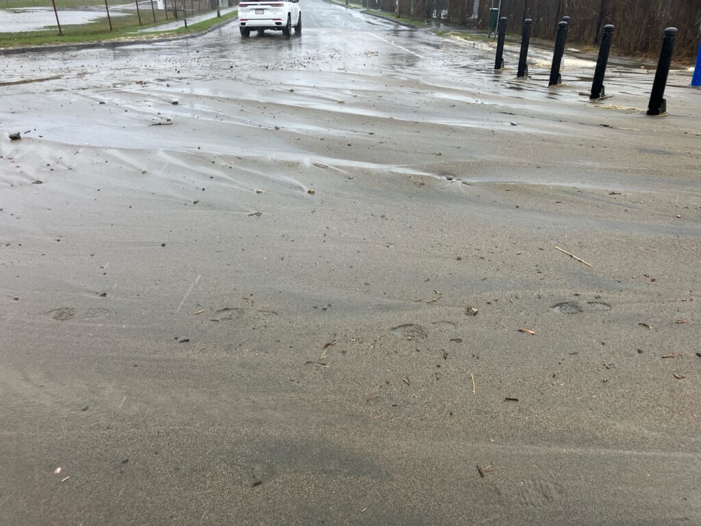 a car driving on a wet road (MyCoast AI)