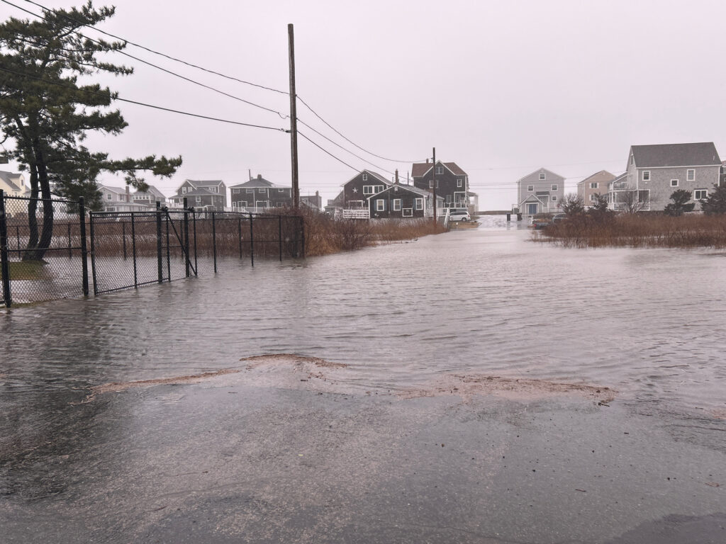 a flooded street with houses (MyCoast AI)