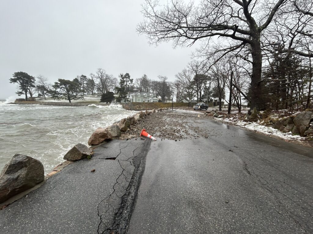 a road with a car on it by a body of water (MyCoast AI)