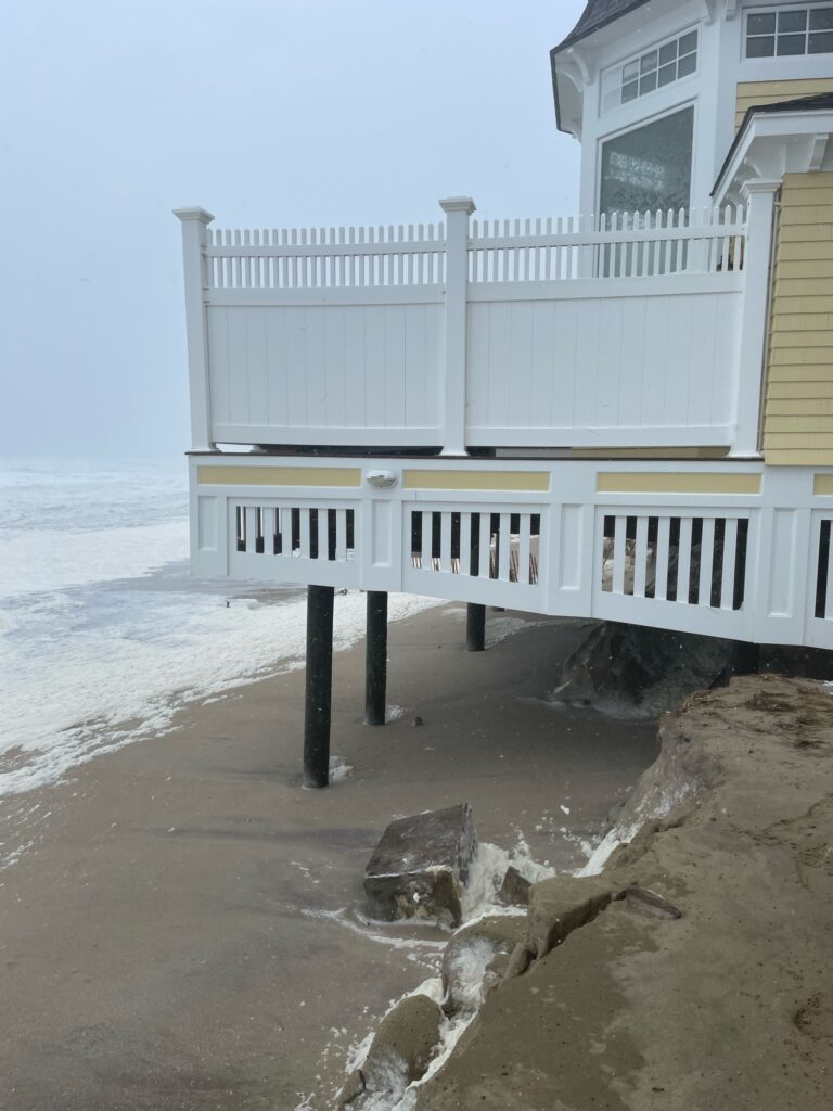 a white house on a beach (MyCoast AI)