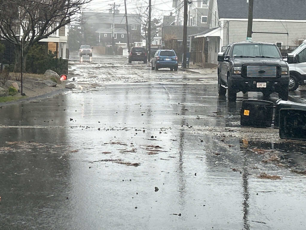 a flooded street with cars and houses (MyCoast AI)