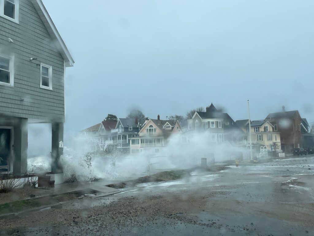 a group of houses with water falling (MyCoast AI)