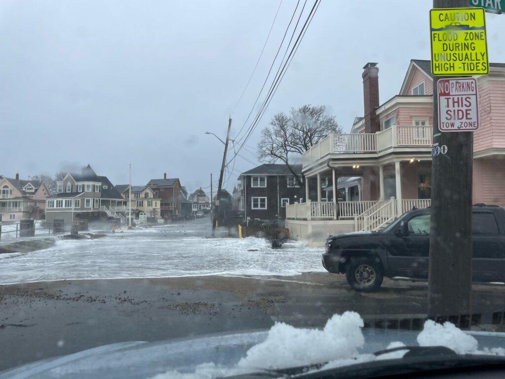 a flooded street with a truck parked on the side (MyCoast AI)