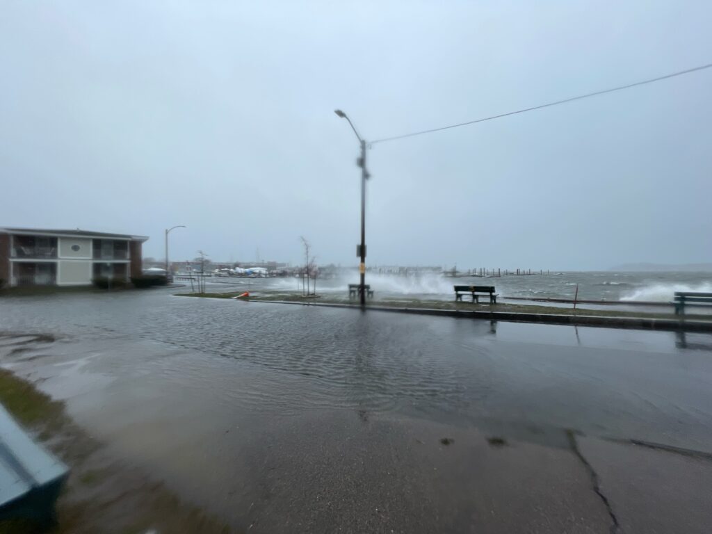 a beach with a pier and a lamp post (MyCoast AI)