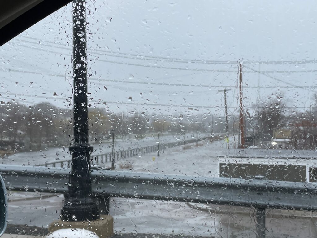 a snow covered street with power lines (MyCoast AI)