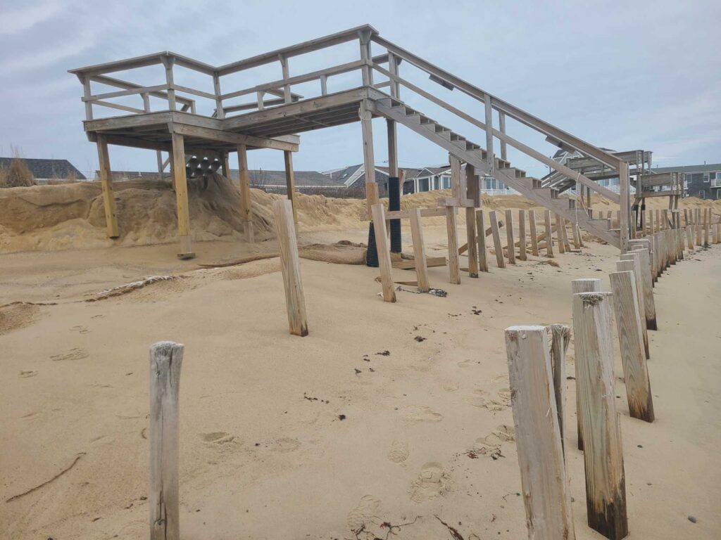 a structure made of wood in a sandy area (MyCoast AI)