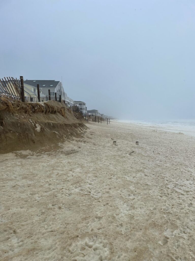 a beach with a house on the shore (MyCoast AI)