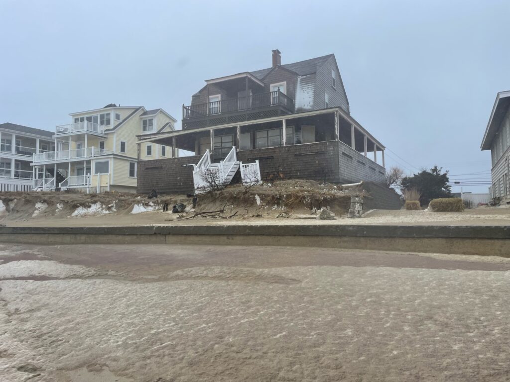 a building with a fence around it (MyCoast AI)