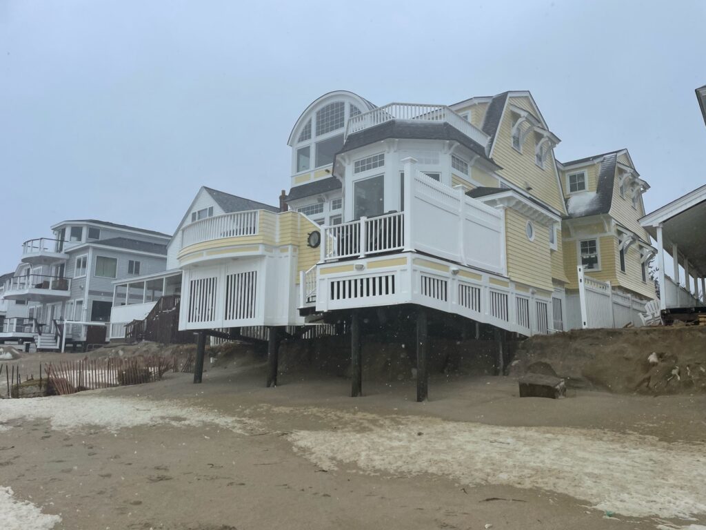 a group of houses on a beach (MyCoast AI)