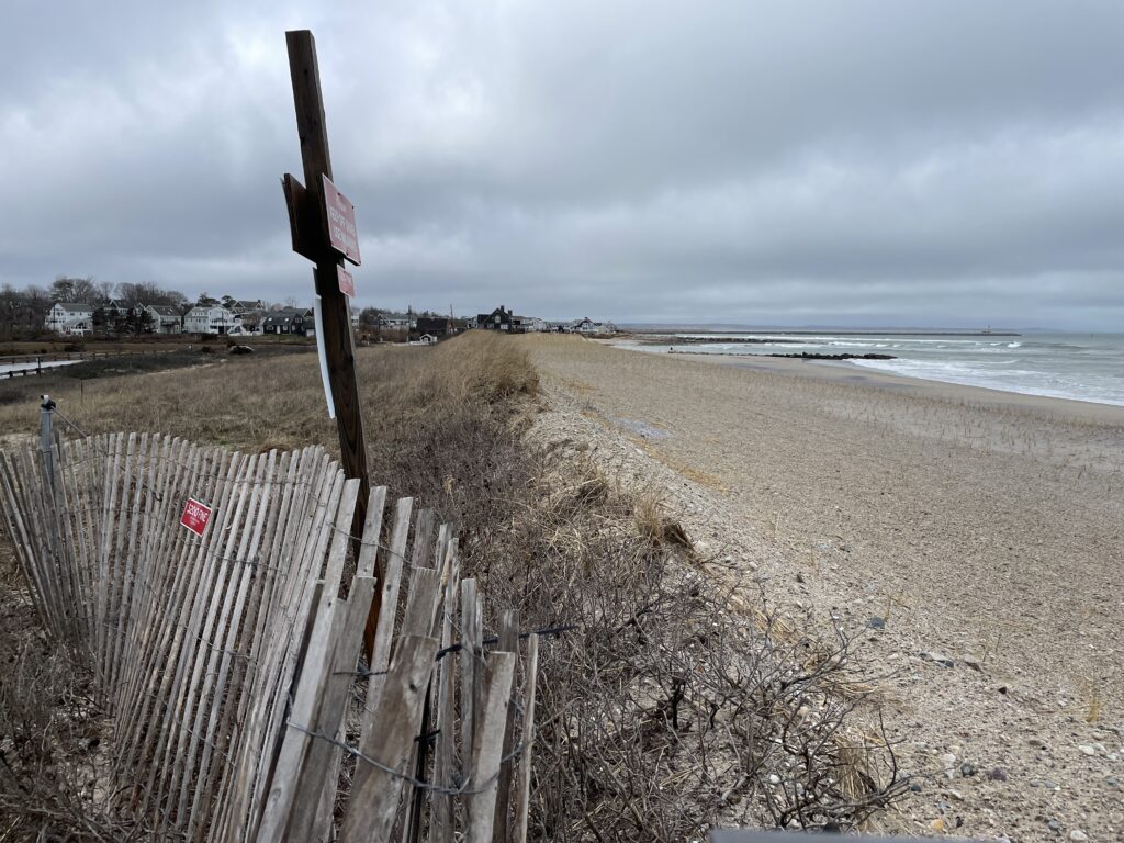 a wooden fence on a beach (MyCoast AI)