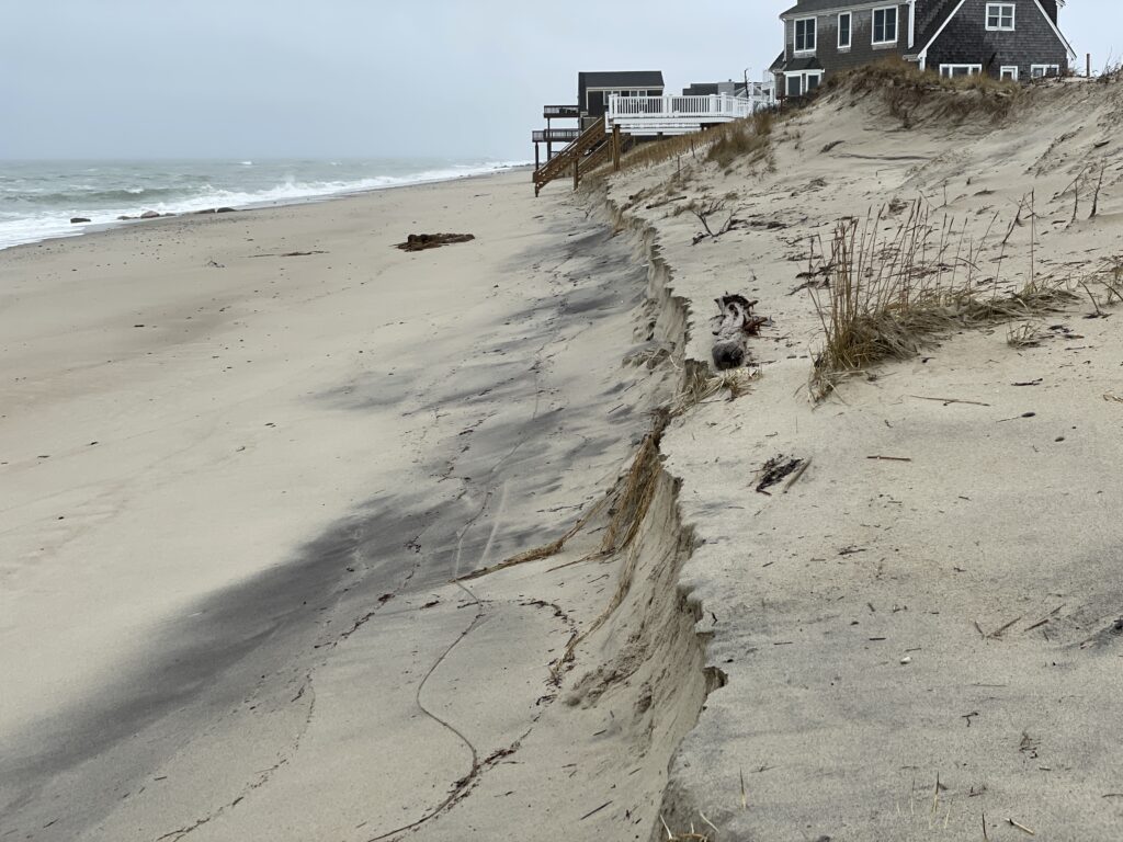 a sandy beach with a house on the shore (MyCoast AI)