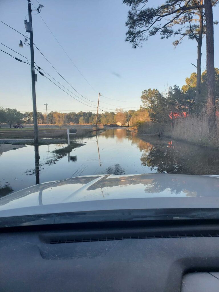 a car driving on a flooded road (MyCoast AI)