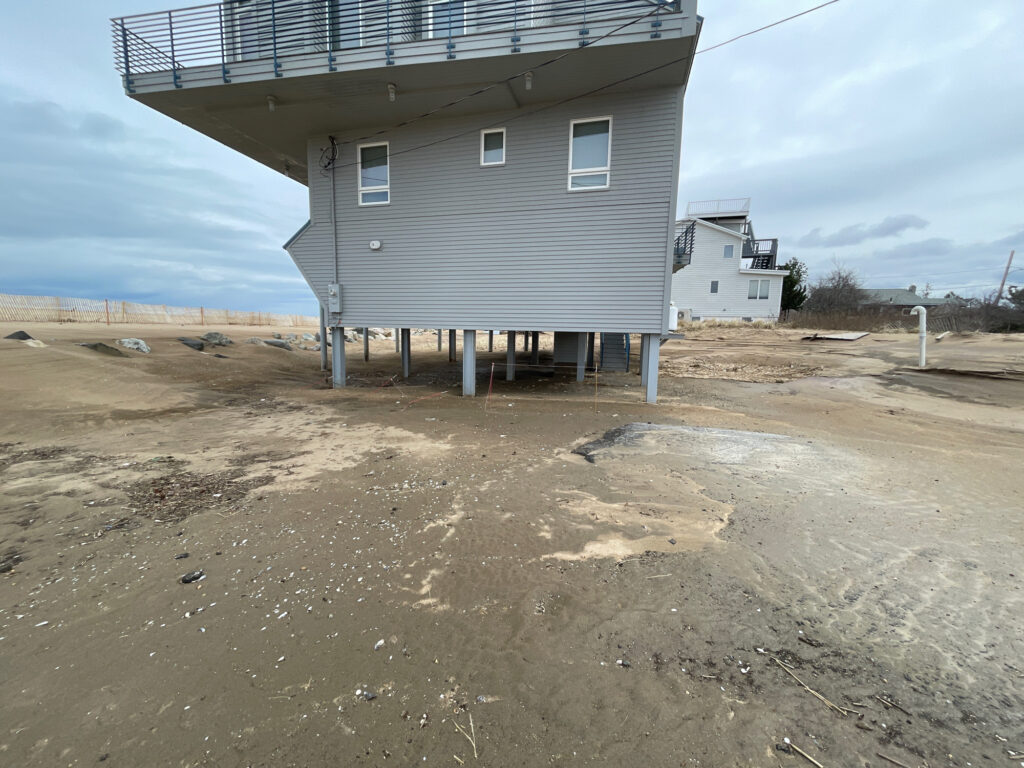 a building with a fence around it (MyCoast AI)