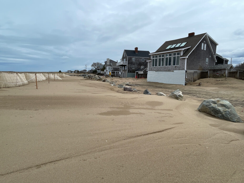 a sandy beach with houses (MyCoast AI)