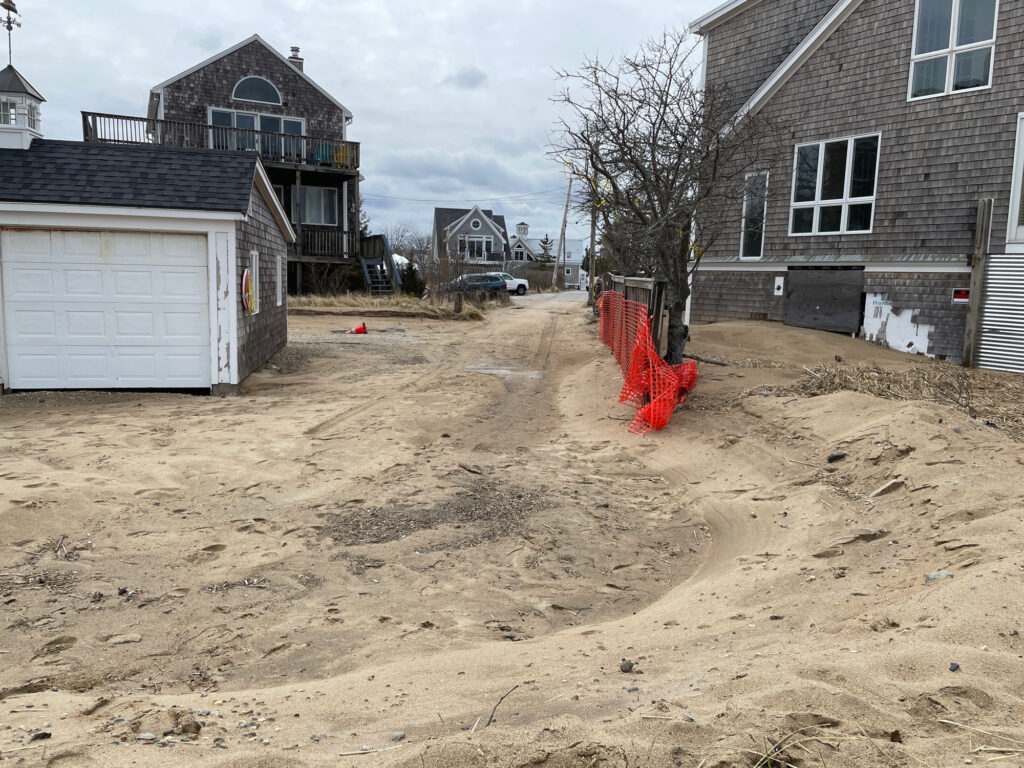 a dirt area with buildings in the background (MyCoast AI)