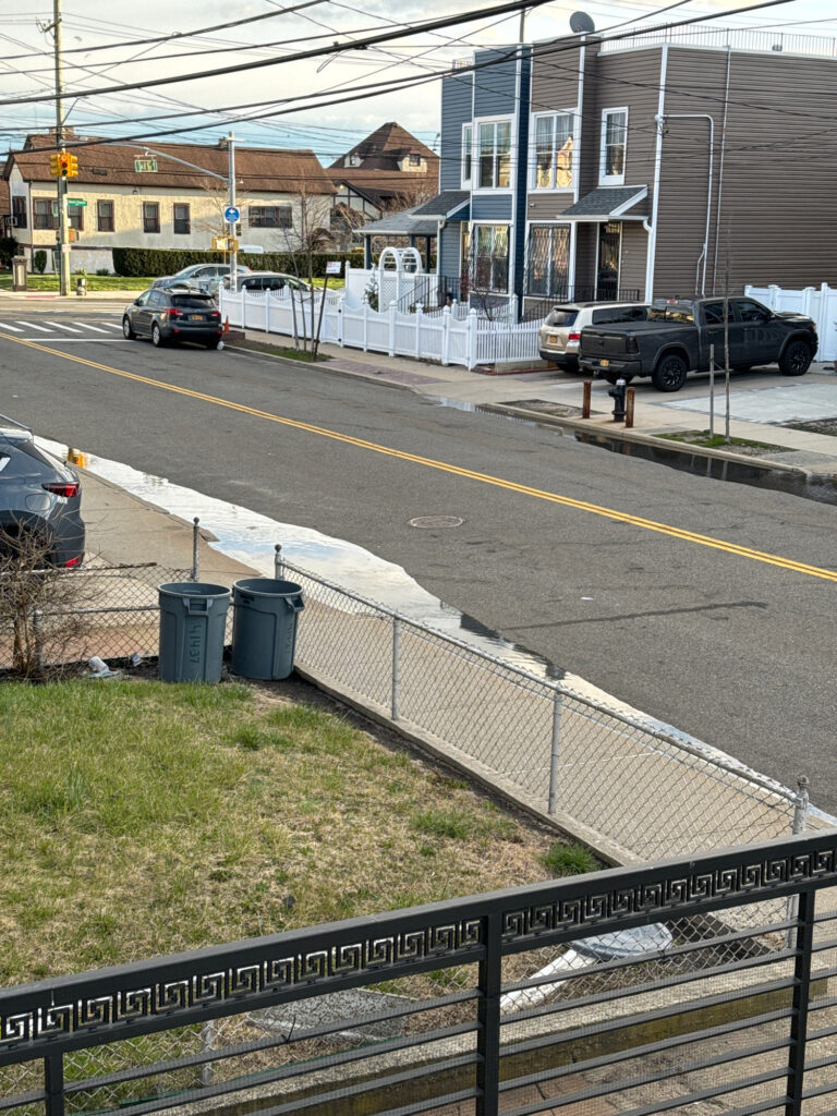 a street with cars parked along it (MyCoast AI)