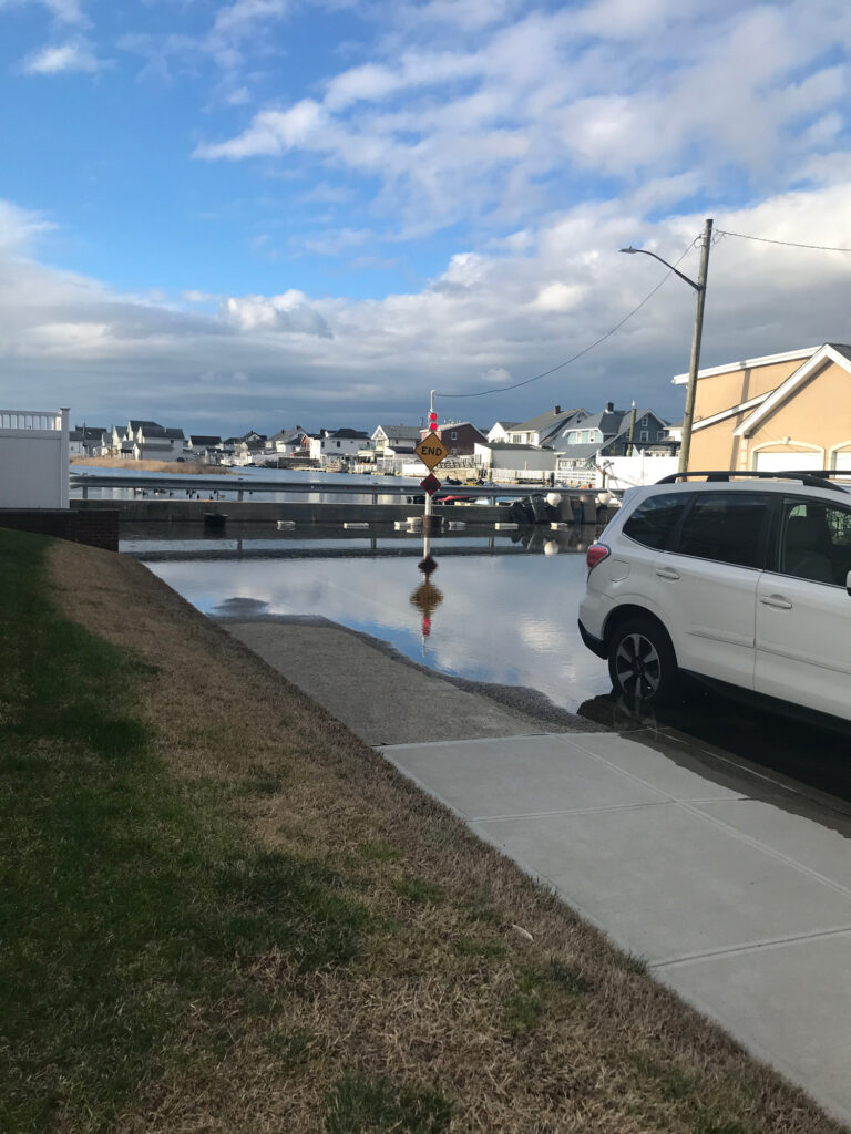 a body of water with a bridge and buildings in the background (MyCoast AI)