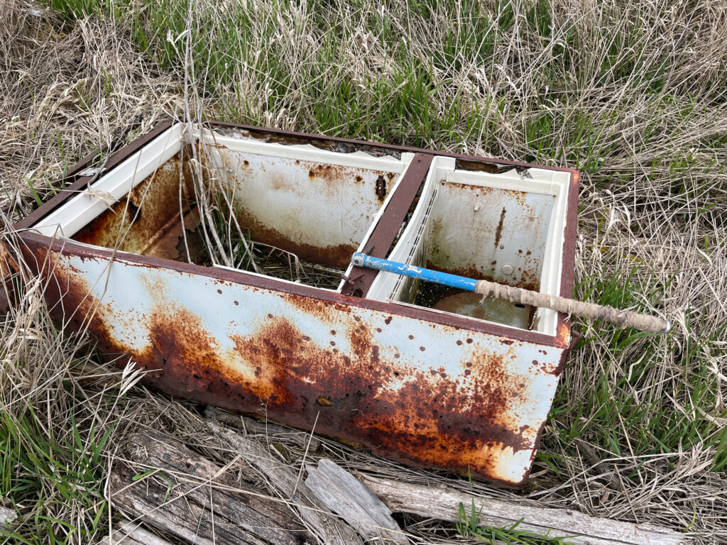 a broken down wooden box (MyCoast AI)