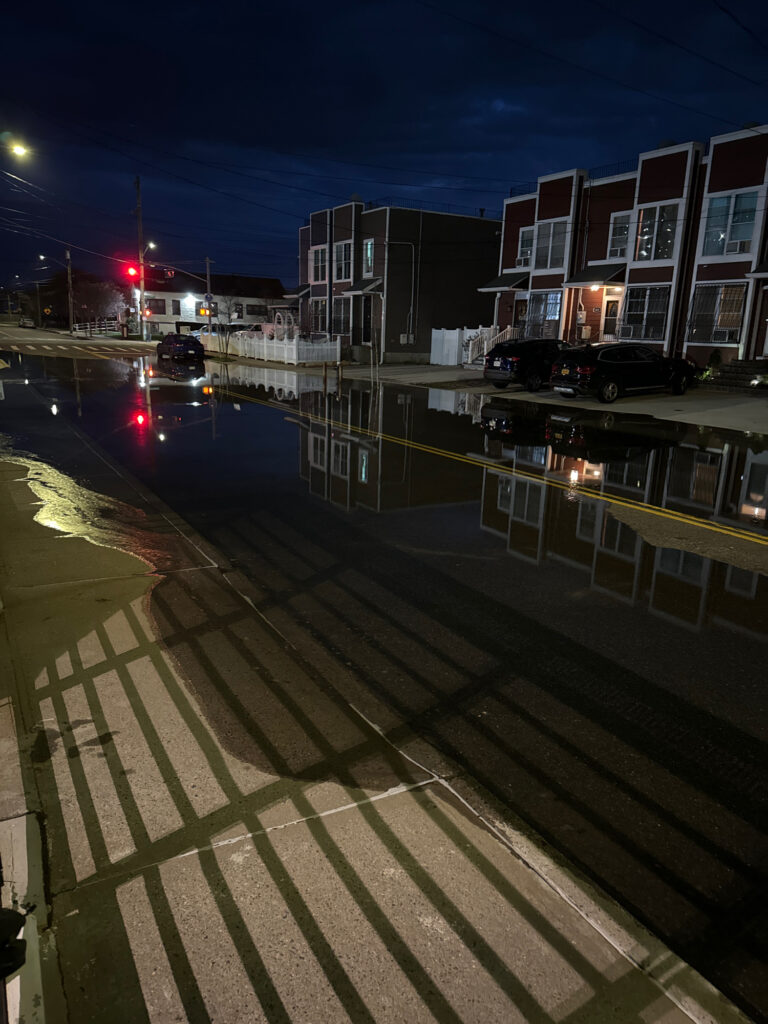 a street with cars on it and buildings on the side (MyCoast AI)