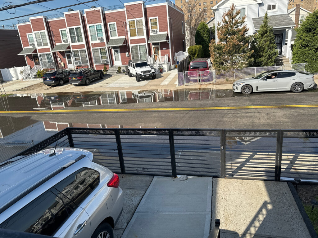 a view of a street from a window of a building (MyCoast AI)