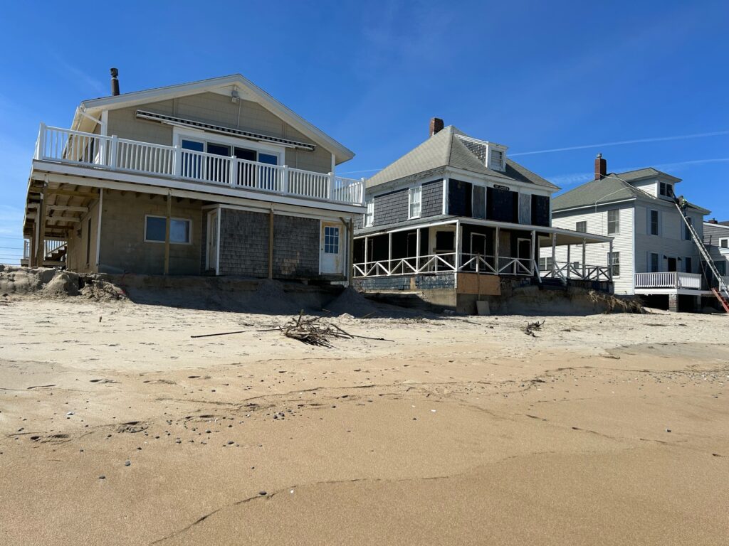 a group of houses on a sandy beach (MyCoast AI)