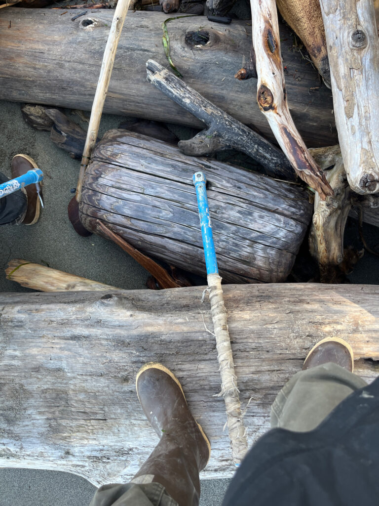 a person's feet and a wooden structure (MyCoast AI)