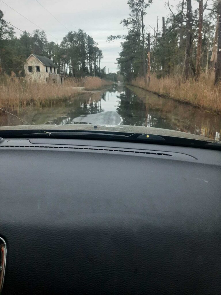 a car driving on a flooded road (MyCoast AI)