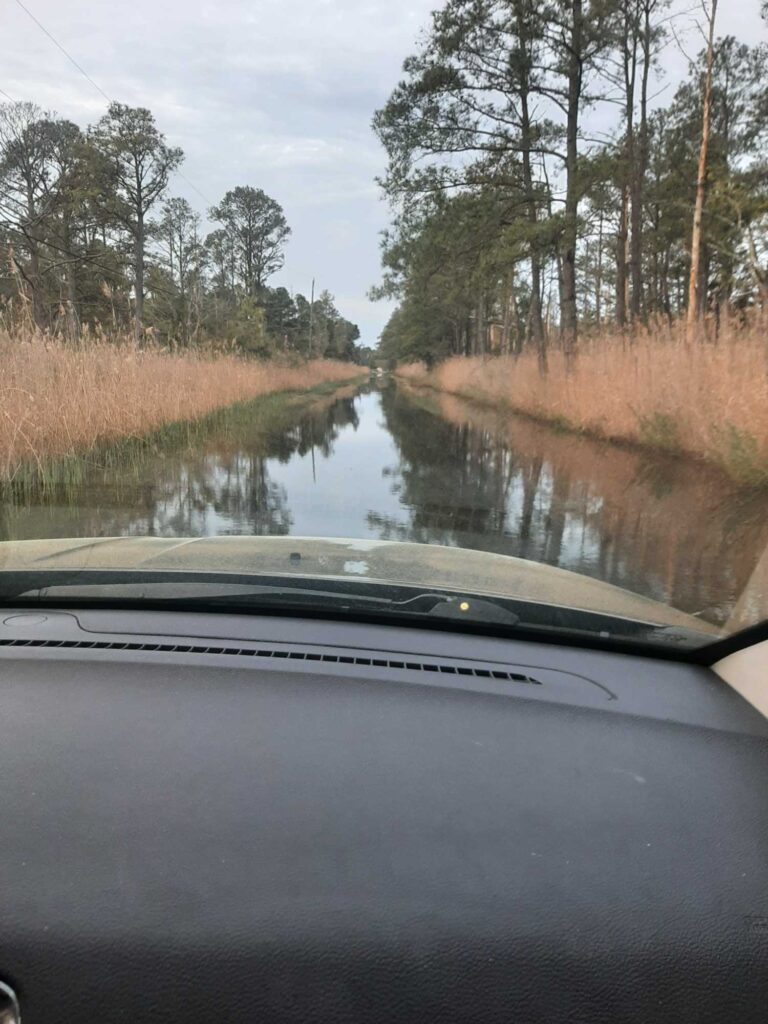 a car driving on a flooded road (MyCoast AI)
