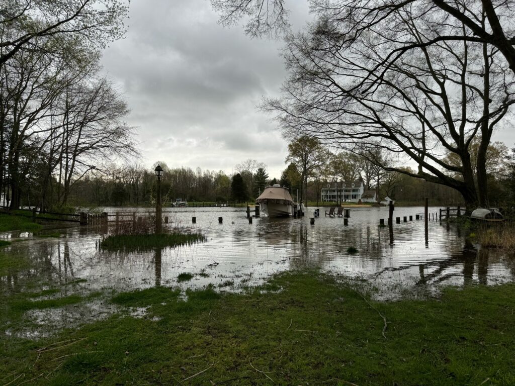 a flooded area with a house in the background (MyCoast AI)