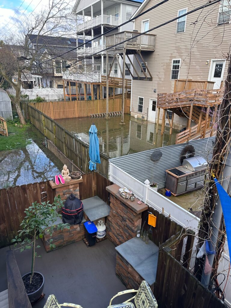 a group of people sitting on a deck of a house (MyCoast AI)