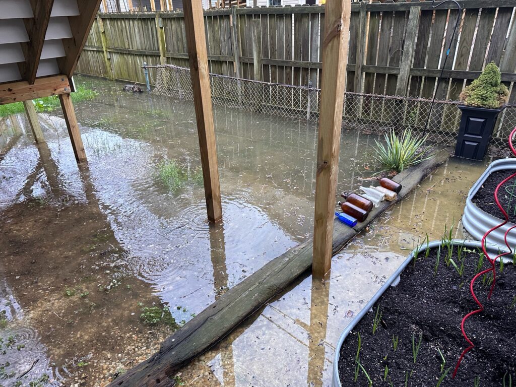 a flooded area with a fence (MyCoast AI)