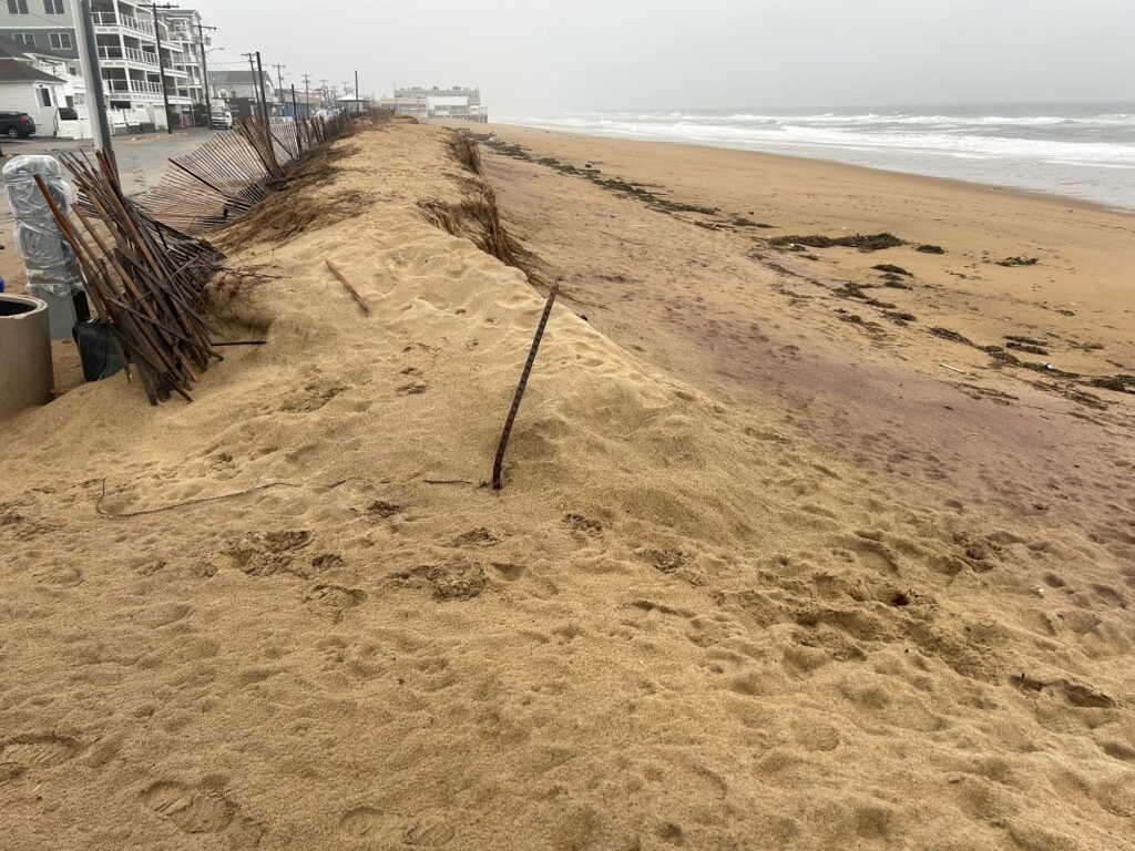 a beach with a net and a chair on it (MyCoast AI)