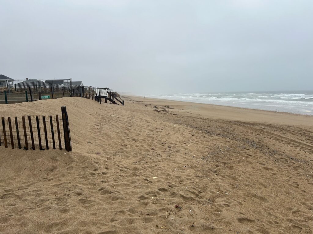 a sandy beach with a bench (MyCoast AI)