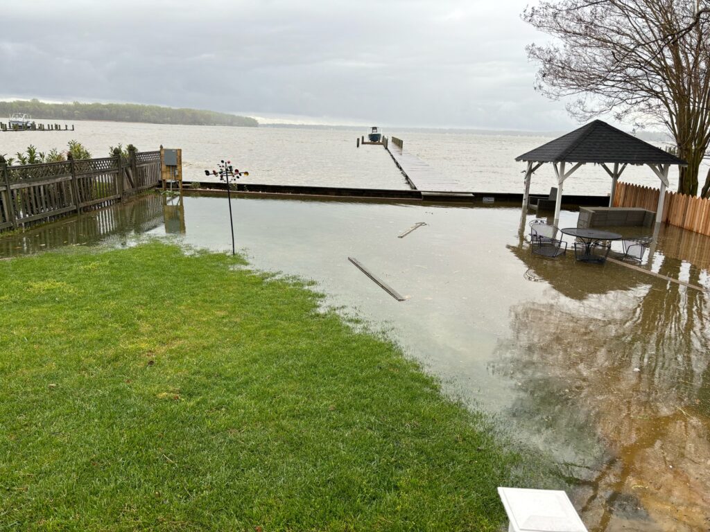 a flooded area with a dock and a covered area (MyCoast AI)