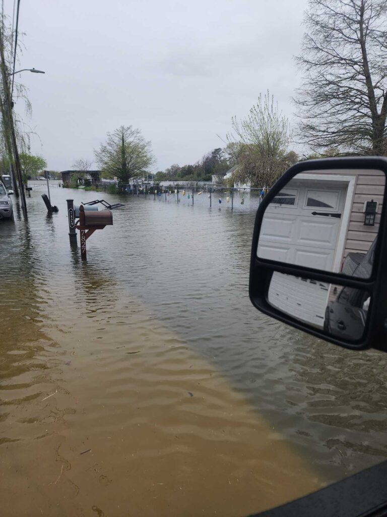 a car driving through a flooded street (MyCoast AI)