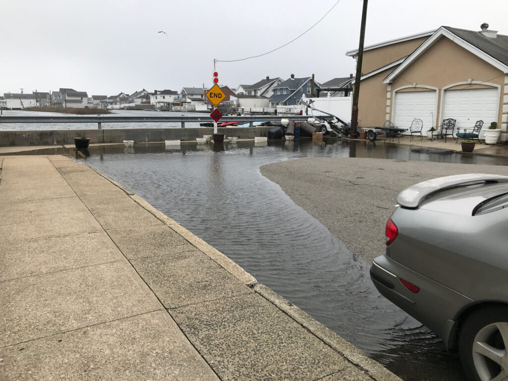 a flooded street with cars (MyCoast AI)